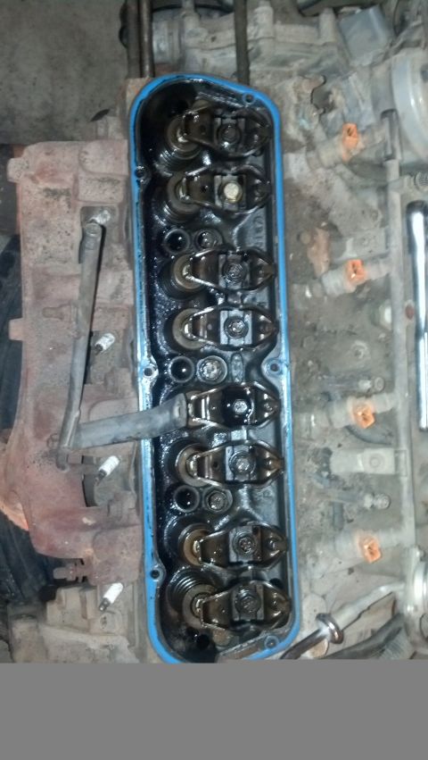 1988 Ford Bronco - The image shows the top of a V8 engine with the valve cover removed, revealing the rocker arms and valve springs. The engine appears to be…