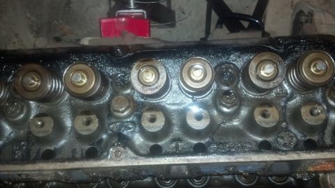 1988 Ford Bronco - This is a close-up view of the top of a Ford V8 engine cylinder head, showing the valve springs, retainers, and valve stems. The cylinder h…