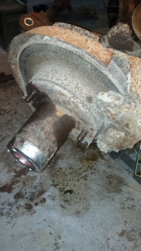 1988 Ford Bronco - Close-up of a heavily rusted brake drum and hub assembly, likely from an older vehicle.
