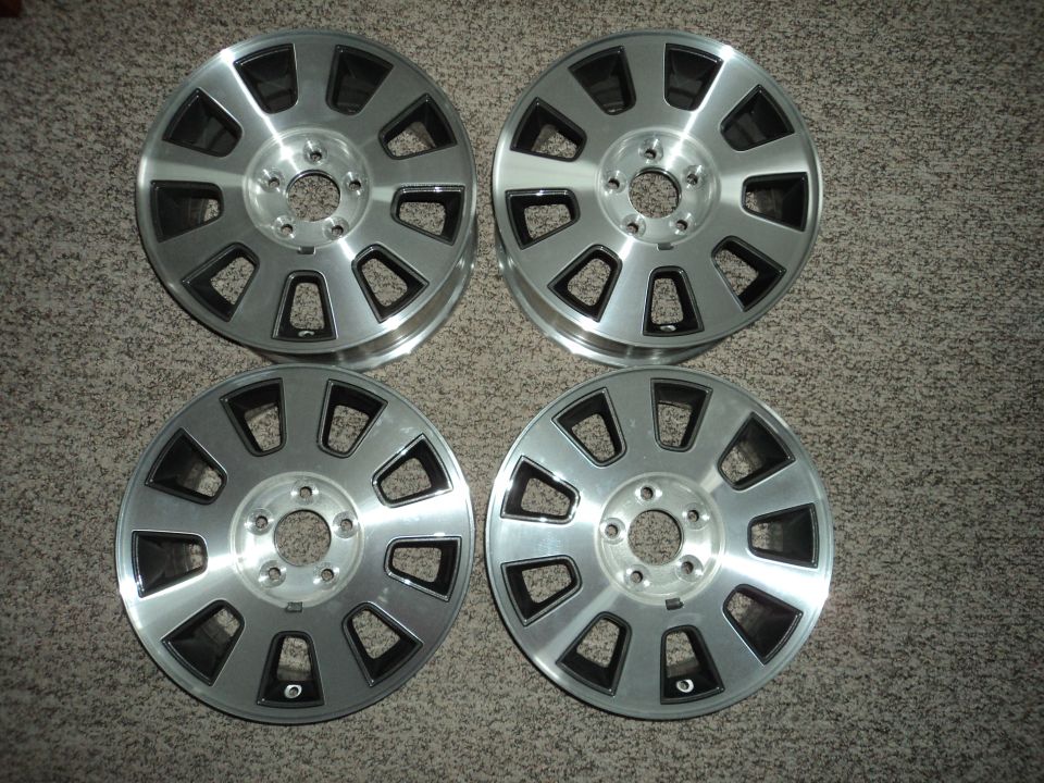 Four silver and black alloy wheels