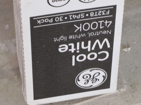 1995 Ford Bronco - A close-up shot of a box for GE Cool White light bulbs. The box is black with white text and features the GE logo.