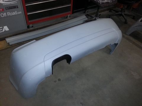 2002 Volkswagen Jetta - A light gray bumper part with a black cutout is shown, with the Supermotors.net logo visible in the lower right corner.