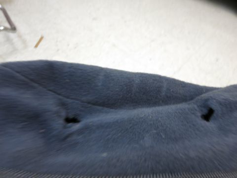 2001 Ford Crown Victoria - Close-up of damaged car seat upholstery with visible tears.
