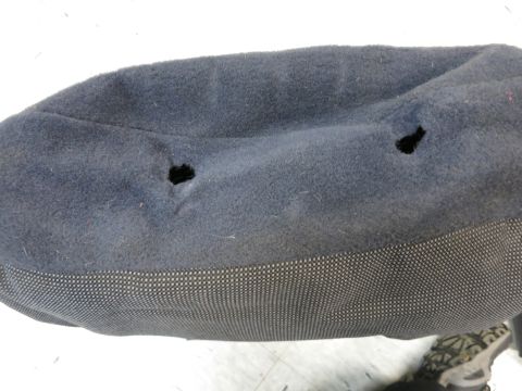 2001 Ford Crown Victoria - Close-up of damaged car seat upholstery, showing wear and tear.