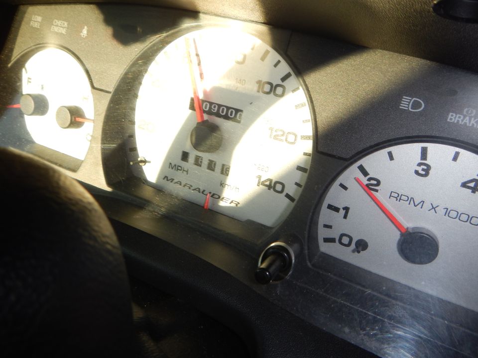 Marauder speedometer reading 09000 beside RPM x1000 tachometer in sunlight