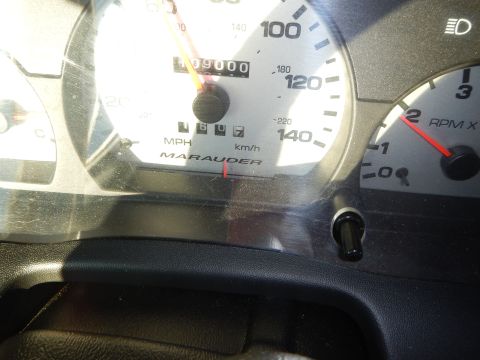 2003 Ford Crown Victoria - Close-up of a Marauder gauge cluster showing the 09000 odometer reading and an RPM x1000 tachometer dial.