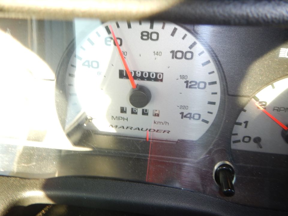 Instrument cluster speedometer reading 109000 miles with Marauder badge