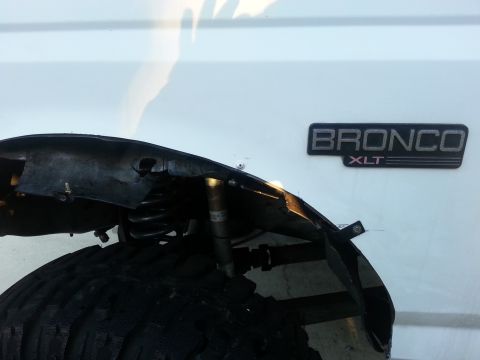 1992 Ford Bronco - used a pop rivet to connect the inner plastic fender to the outer. the result is much better than the ugly bolts...