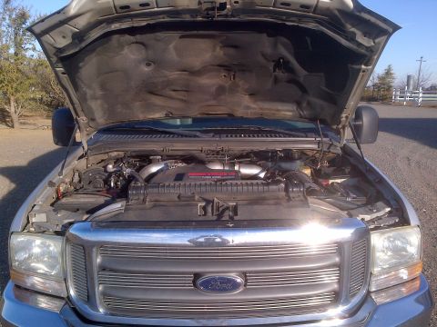 1985 Jeep CJ7 - Engine bay of a Ford Super Duty truck, showing the V8 Power Stroke Diesel engine.