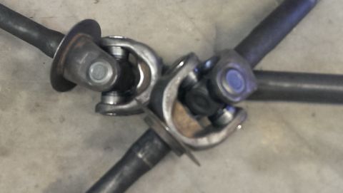 1995 Ford Bronco - Three driveshaft universal joints are shown connected together.