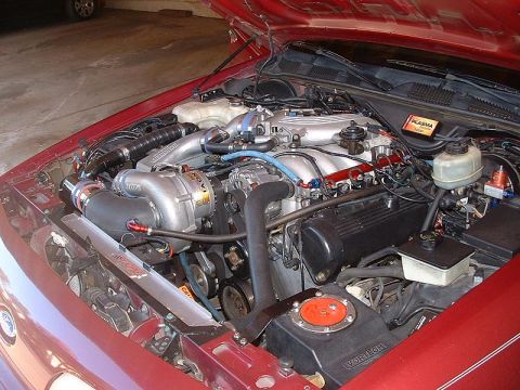 1992 Ford Crown Victoria - The engine bay of a 1992 Ford Crown Victoria shows a Vortech supercharger and custom intercooler system.