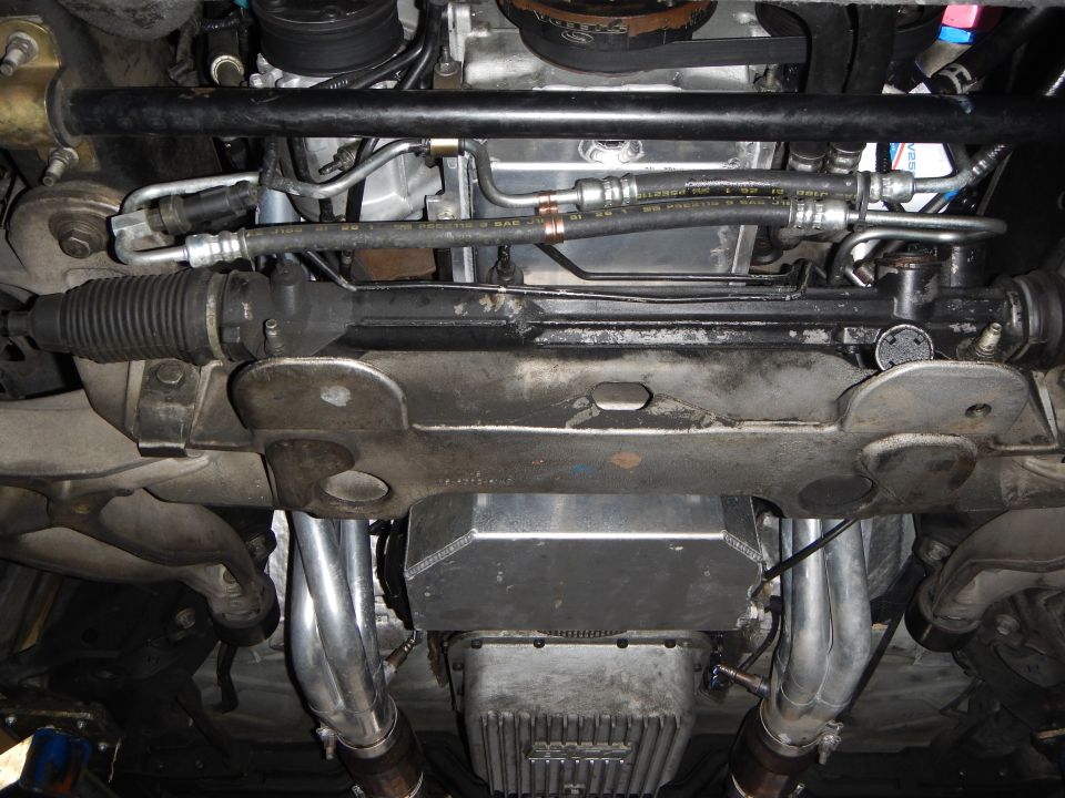 Underbody view of steering rack, crossmember and oil pan