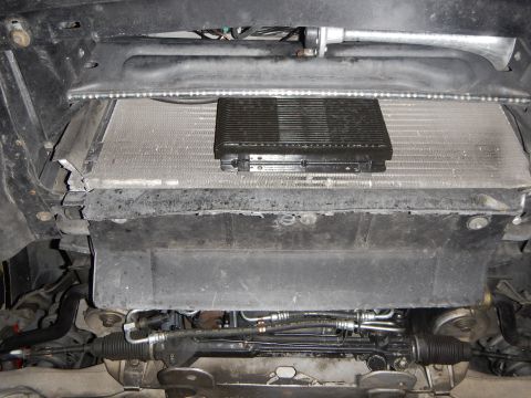 2003 Ford Crown Victoria - Photo of the vehicle front from below showing radiator, oil cooler and steering rack.