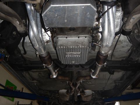 2003 Ford Crown Victoria - Photo of a vehicle underbody showing dual exhaust piping, oil pan and rear crossover.