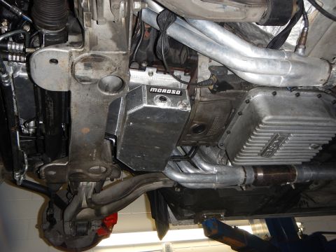 2003 Ford Crown Victoria - Photo of a vehicle underbody showing a Moroso oil pan with headers and exhaust piping.