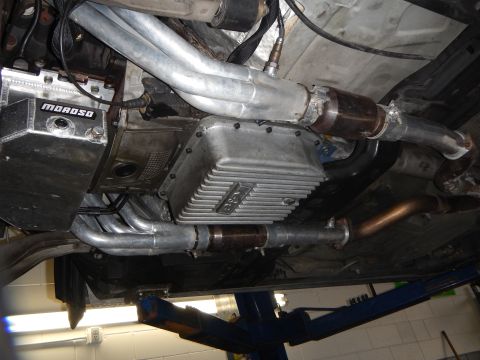 2003 Ford Crown Victoria - Photo of a vehicle underbody showing a Moroso oil pan, dual exhaust and catalytic converters.