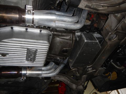 2003 Ford Crown Victoria - Photo of a vehicle underbody showing a finned aluminum oil pan and exhaust piping.
