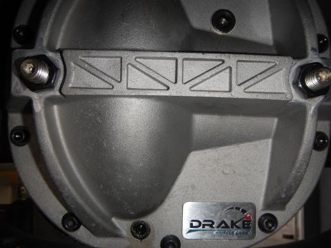 2003 Ford Crown Victoria - Photo close-up of an aluminum Drake Muscle Cars rear differential cover with finned ribs.