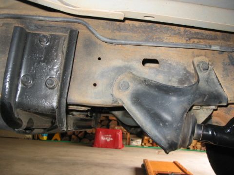 1991 Ford Bronco - Detail of the vehicle's undercarriage, focusing on the frame and suspension mounting points.