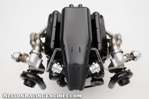 1994 Ford Bronco - Product photograph of a twin-turbo V8 racing engine shown from the front on a white background.