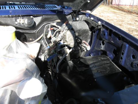 1982 Ford Bronco - The interior of a dark blue SUV is visible, including the dashboard and seating area.