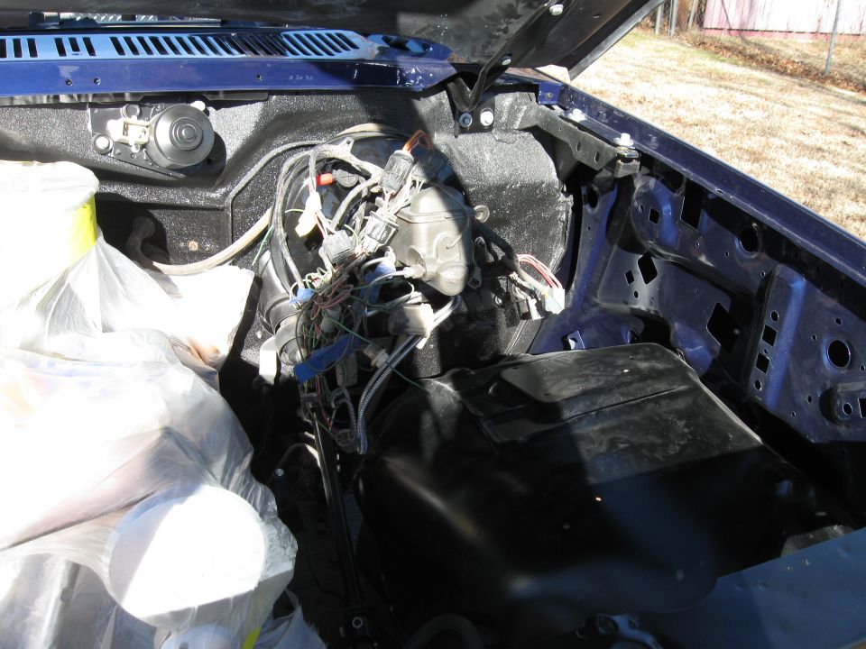 Interior view of a dark blue SUV, showing dashboard and seats