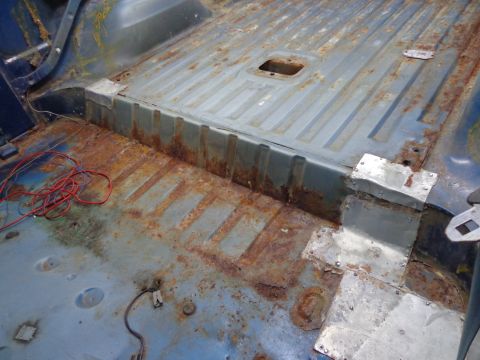 1979 Ford Bronco - The interior floor of this vehicle shows extensive rust and repair work.