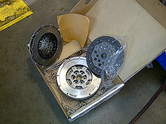 New clutch kit parts in an open box.