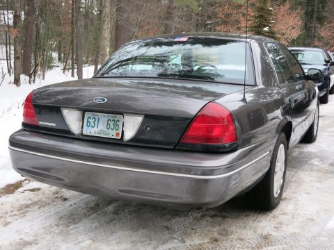 2001 Ford Crown Victoria - Photograph of a gray Ford Crown Victoria rear with a New Hampshire plate, not a technical document.