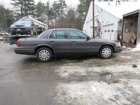 2001 Ford Crown Victoria - Side-profile photograph of a Ford Crown Victoria sedan, not a technical document.