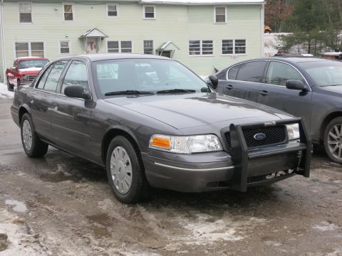 2001 Ford Crown Victoria - Photograph of the front of a Ford Crown Victoria with push bar, not a technical document.