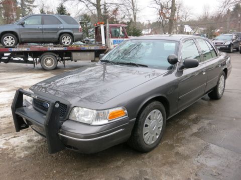 2001 Ford Crown Victoria - Photograph of a Ford Crown Victoria Police Interceptor, not a technical document.