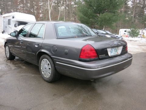 2001 Ford Crown Victoria - Photograph of a Ford Crown Victoria from the rear quarter, not a technical document.