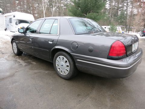 2001 Ford Crown Victoria - Photograph of a Ford Crown Victoria from the rear quarter, not a technical document.