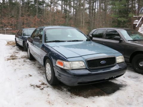 2001 Ford Crown Victoria - Photograph of a blue Ford Crown Victoria from the front quarter, not a technical document.