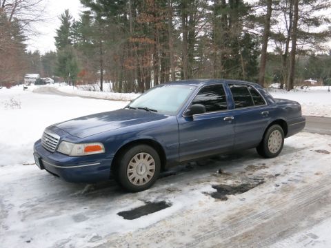 2001 Ford Crown Victoria - Photograph of a blue Ford Crown Victoria from the front quarter, not a technical document.