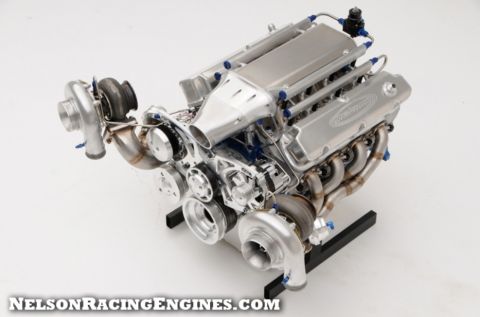 1994 Ford Bronco - Product photograph of a twin-turbo small-block Ford racing engine on a display stand.