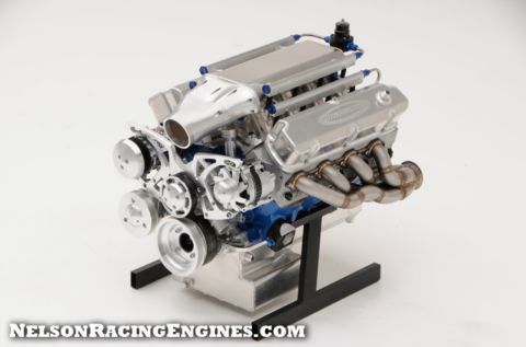 1994 Ford Bronco - Product photograph of a turbocharged Ford racing engine with exhaust headers on a display stand.
