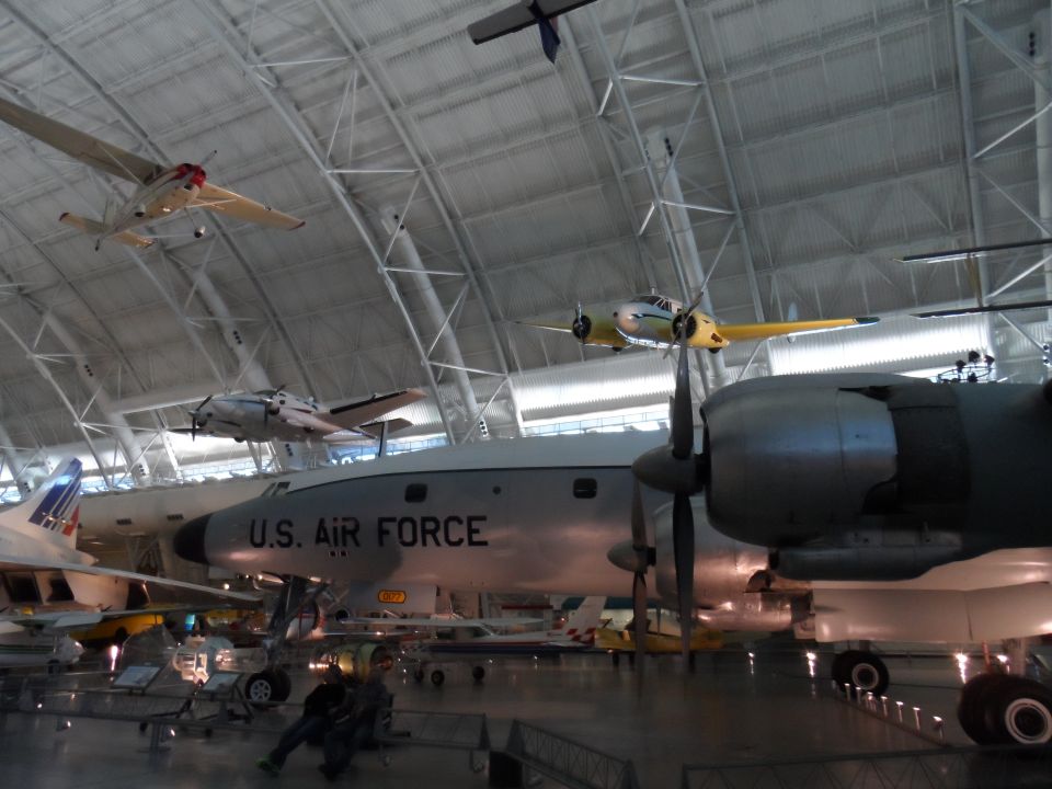 Museum interior with multiple aircraft, including a large U.S. Air Force plane.