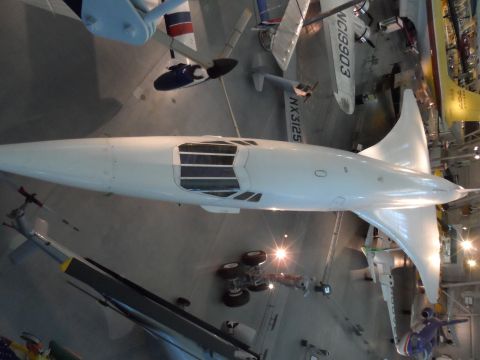 1971 Ford Ranchero - A white aircraft is displayed indoors, surrounded by other aircraft and exhibits.