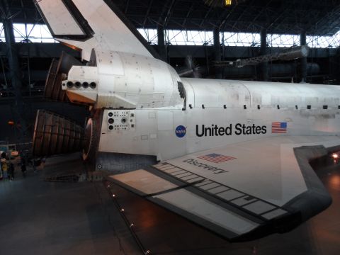 1971 Ford Ranchero - The Space Shuttle Discovery is shown in a hangar, displaying its distinctive markings and engines.