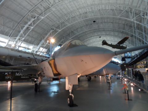 1971 Ford Ranchero - A modern fighter jet is displayed indoors, with other aircraft visible in the background.