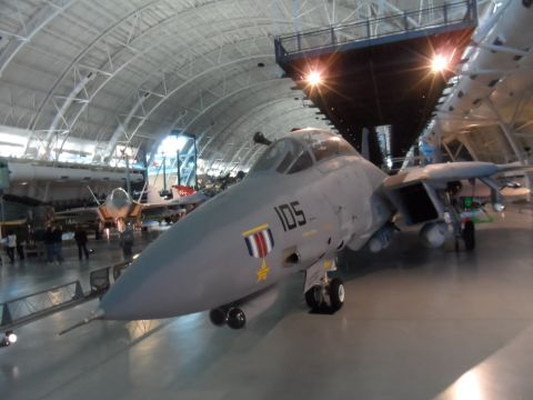 1971 Ford Ranchero - Museum display features an F-14 Tomcat fighter jet alongside other aircraft in a large hangar.