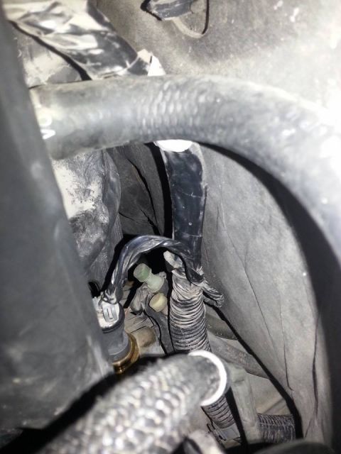 1995 Ford F-150 - Engine bay wiring and hoses are visible in this close-up view.