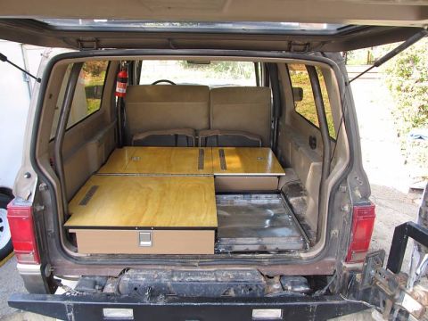 1990 Ford Bronco II - Shows the storage unit assembled with slideout tray for a 12-volt refrigerator.