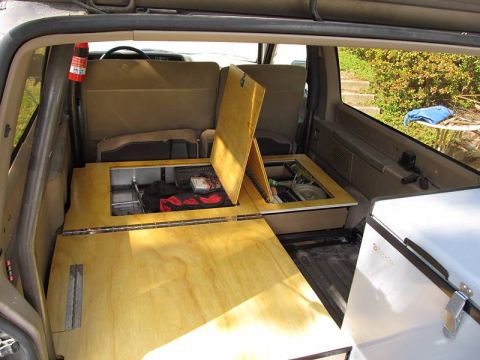 1990 Ford Bronco II - Two storage boxes built into the floor for lesser-used items (tools, vehicle recovery gear, extra fluids, etc.).
