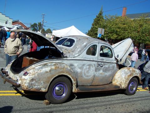 1971 Ford Ranchero - A weathered coupe sits with its hood and trunk open, displaying its unfinished state.