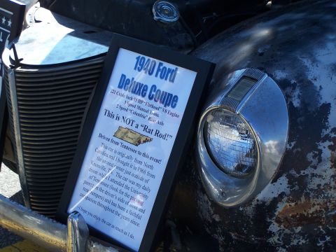 1971 Ford Ranchero - A sign details a 1940 Ford Deluxe Coupe, stating 'This is NOT a "Rat Rod!"'