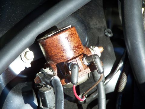 1971 Ford Ranchero - Close-up view of a corroded starter solenoid with visible wiring and hoses.