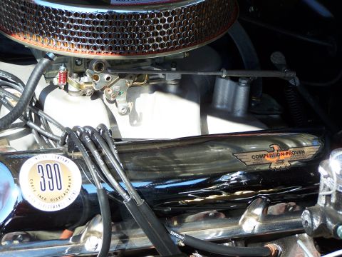 1971 Ford Ranchero - Engine detail with prominent "390" displacement badge and a chrome valve cover with an eagle emblem.